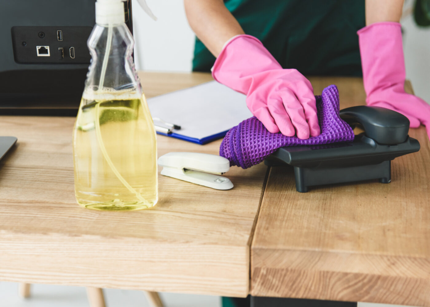 Cropped,Shot,Of,Woman,In,Rubber,Gloves,Cleaning,Telephone,On